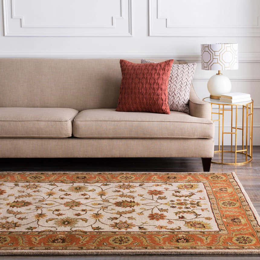 Living room scene with a beige couch and the Medaryville Area Rug in beige and burnt orange. Roomscene-Rectangle