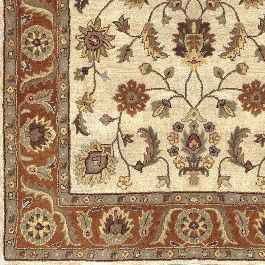 Close-up of the hand-tufted Medaryville Area Rug. Beige wool rug with brick red, brown, and taupe floral and leaf pattern. Swatch