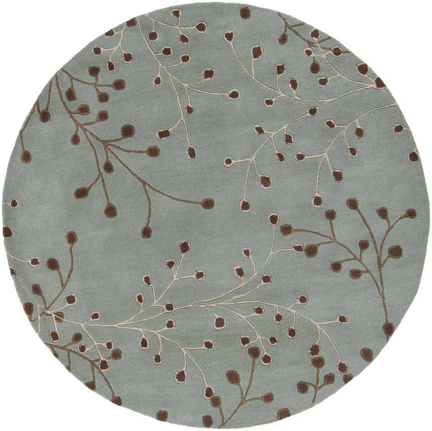 Close-up of the round Sage Elsu Area Rug, featuring a sage background with brown and taupe floral branch pattern. Design-Round-6