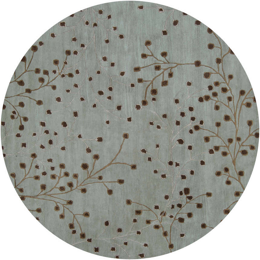 Close-up of a round Sage Elsu Area Rug with a sage background and dark brown floral branch pattern. Design-Round-8