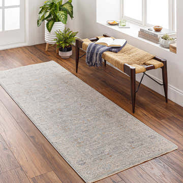 Entryway with Merv Beige Neutral rug runner, wood floors, woven bench, and natural light. Farmhouse style. Roomscene-Runner