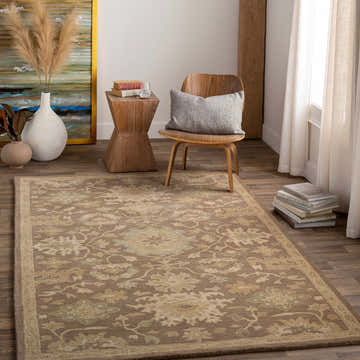 Living room scene with a Hazen Hand Tufted Beige 1149 Area Rug, wood chair, side table, and neutral decor. Roomscene-Rectangle