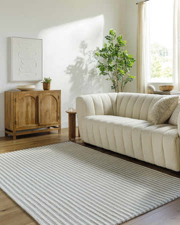Living room with cream sofa and Missa Medium Gray Area Rug. Roomscene-Rectangle