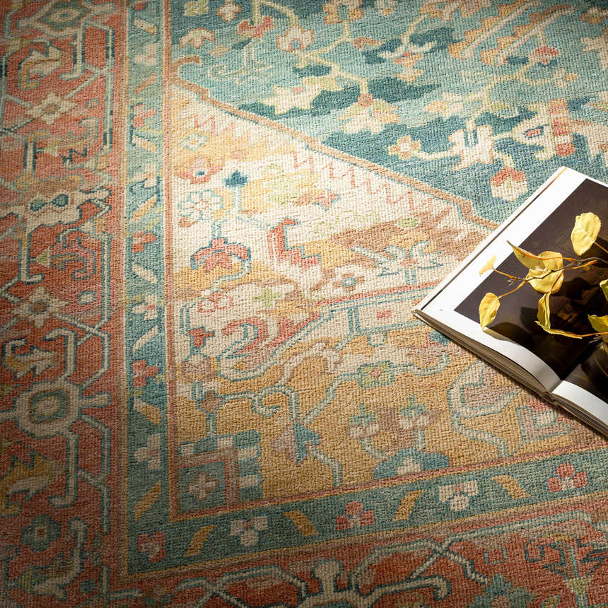 Close-up of the hand-knotted Managa Premium Rug. Colors include camel, light beige, saffron, sage, and tan. Oriental rug style. Styleshot