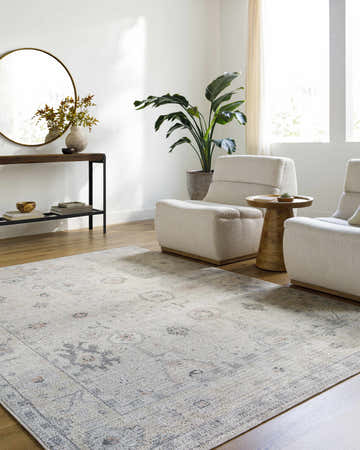 Living room scene with beige armchairs and the beige, gray, and coral Umeko Area Rug. Roomscene-Rectangle