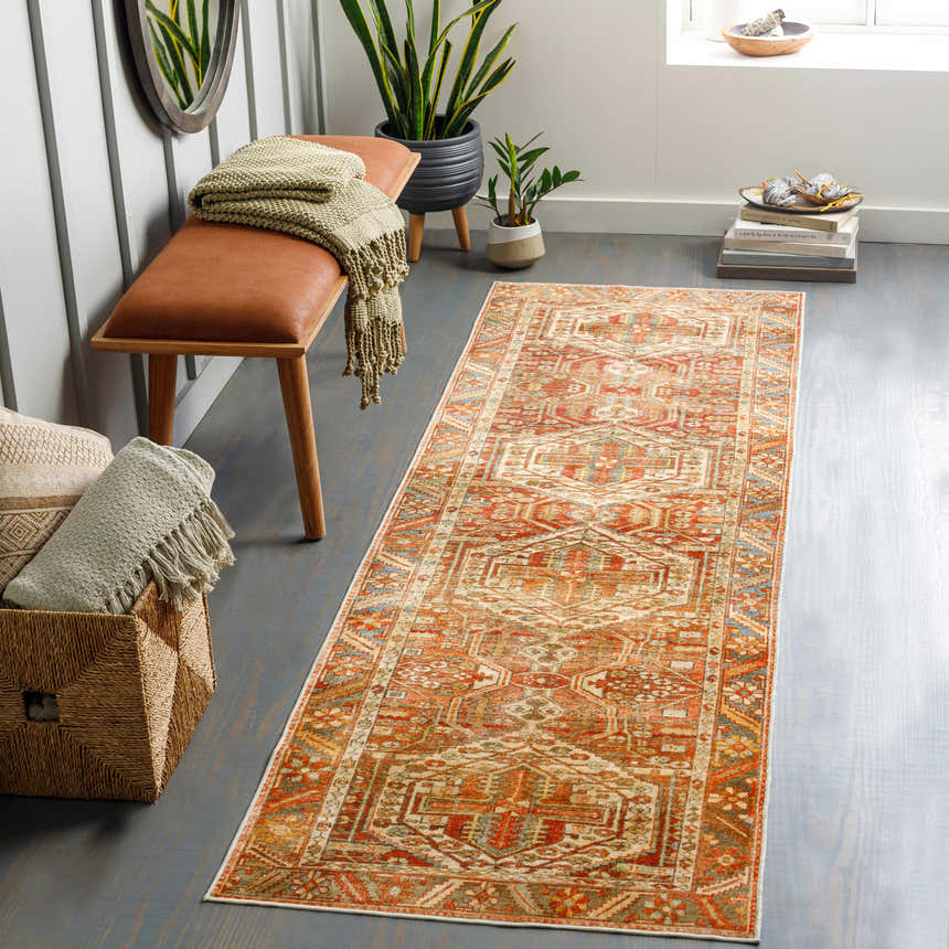 Entryway with brick red Mantalongon Washable Area Rug runner, leather bench, plants, and gray wood floors. Roomscene-Runner
