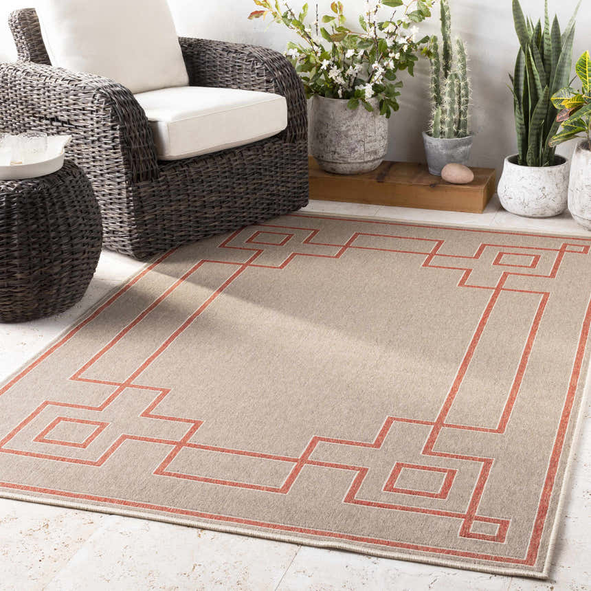 Patio scene with a beige Moffett Area Rug featuring a brick red geometric border design. Roomscene-Rectangle