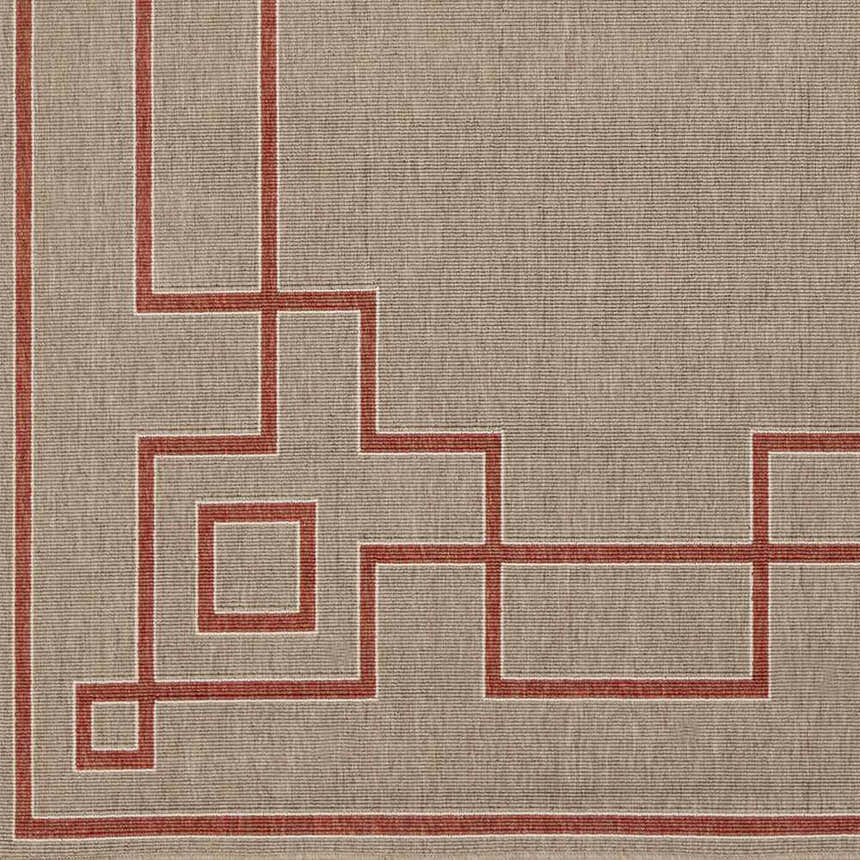 Close-up of Moffett Area Rug. Light brown olefin rug with a brick red geometric border pattern. Swatch