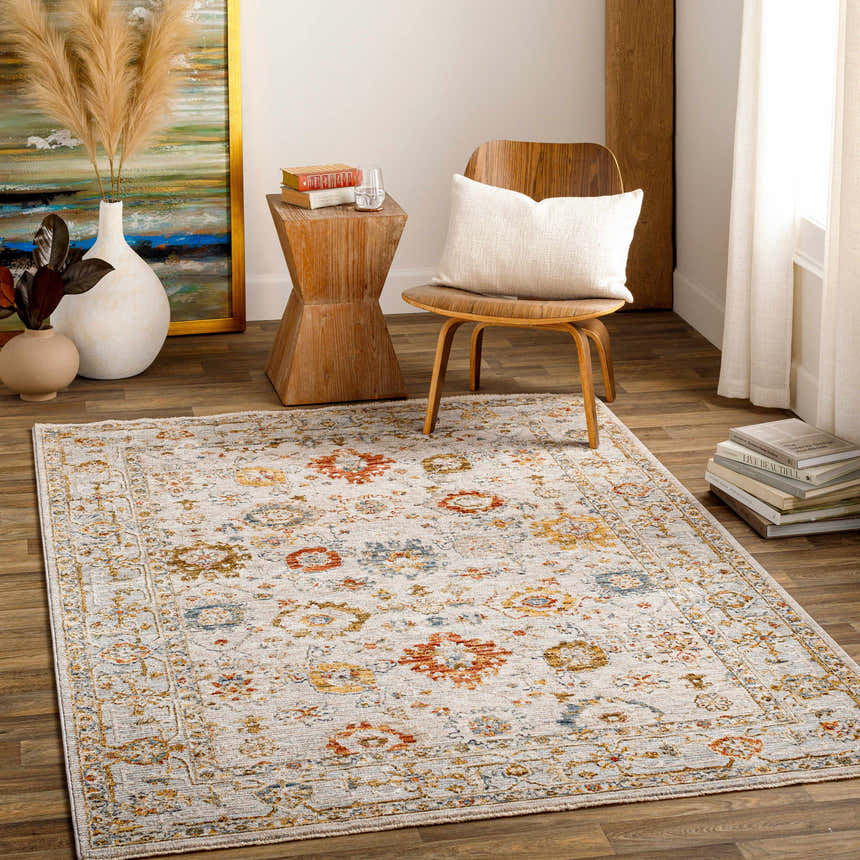 Living room scene with a brick red, cream, and denim Mogul Luxe Oushak Rug, wood chair, and decorative vases. Roomscene-Rectangle