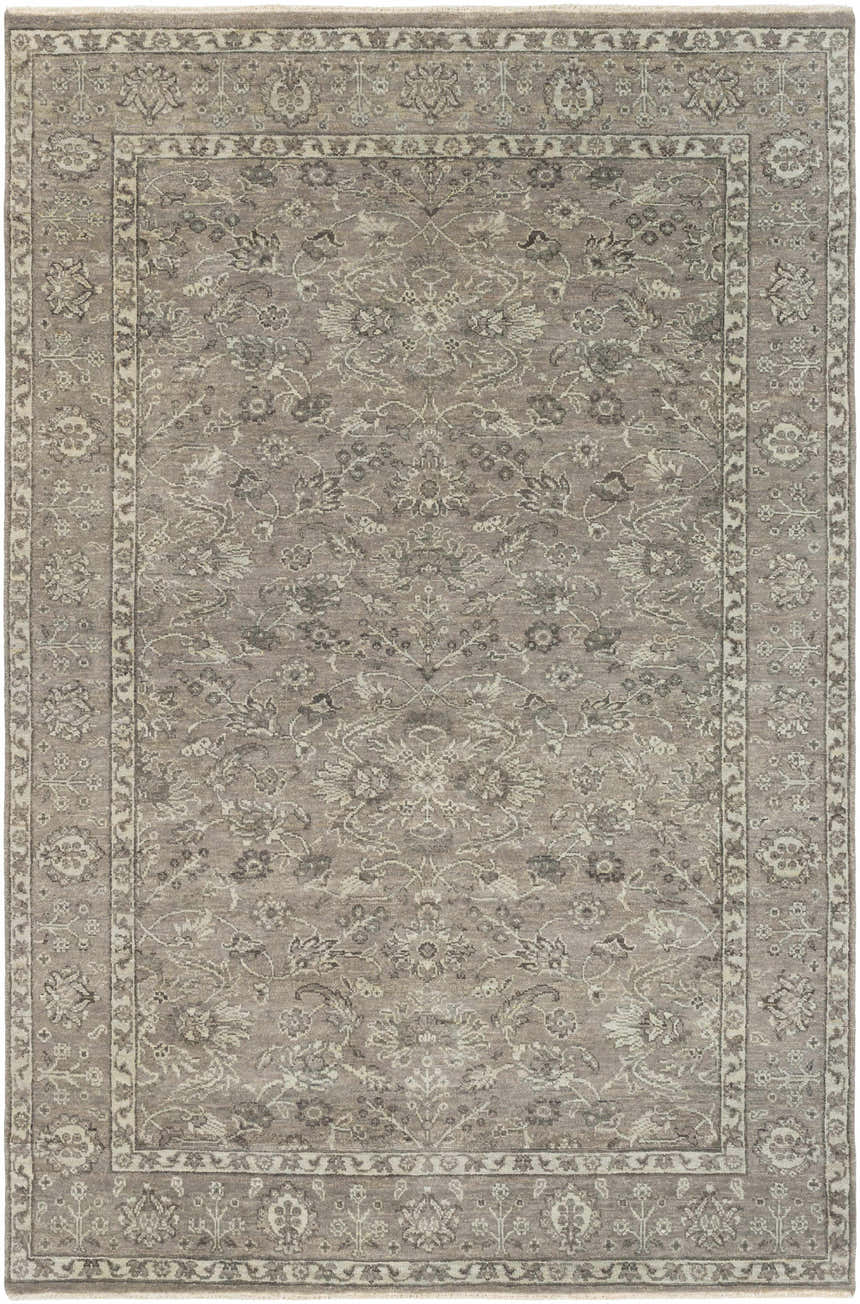 Close-up of the Momeyer Area Rug. Hand-knotted wool rug in dark brown, light gray, and taupe with a traditional floral pattern. Design-Rectangle-69
