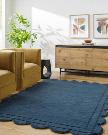 Living room scene with the Uhuro Blue Geometric Area Rug, mustard chairs, and wood cabinet. Roomscene-Rectangle
