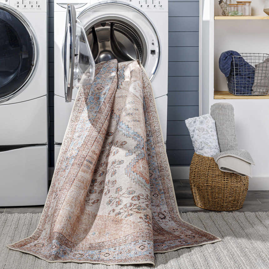 Moora Washable Area Rug in a laundry room, being taken out of a washing machine. Easy clean rug. Washing-Machine