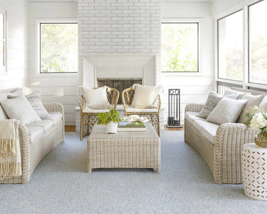 Sunroom with wicker furniture and a light gray Mirit Area Rug. Farmhouse style. Roomscene-Rectangle