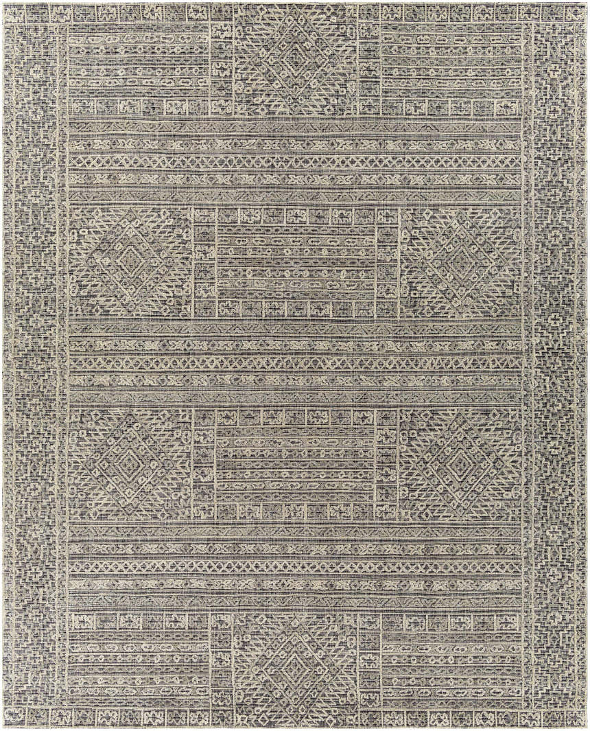 Close-up of the Nairne Textured Wool Area Rug. Features a black, gray, and taupe bohemian pattern and hand tufted texture. Design-Rectangle-810
