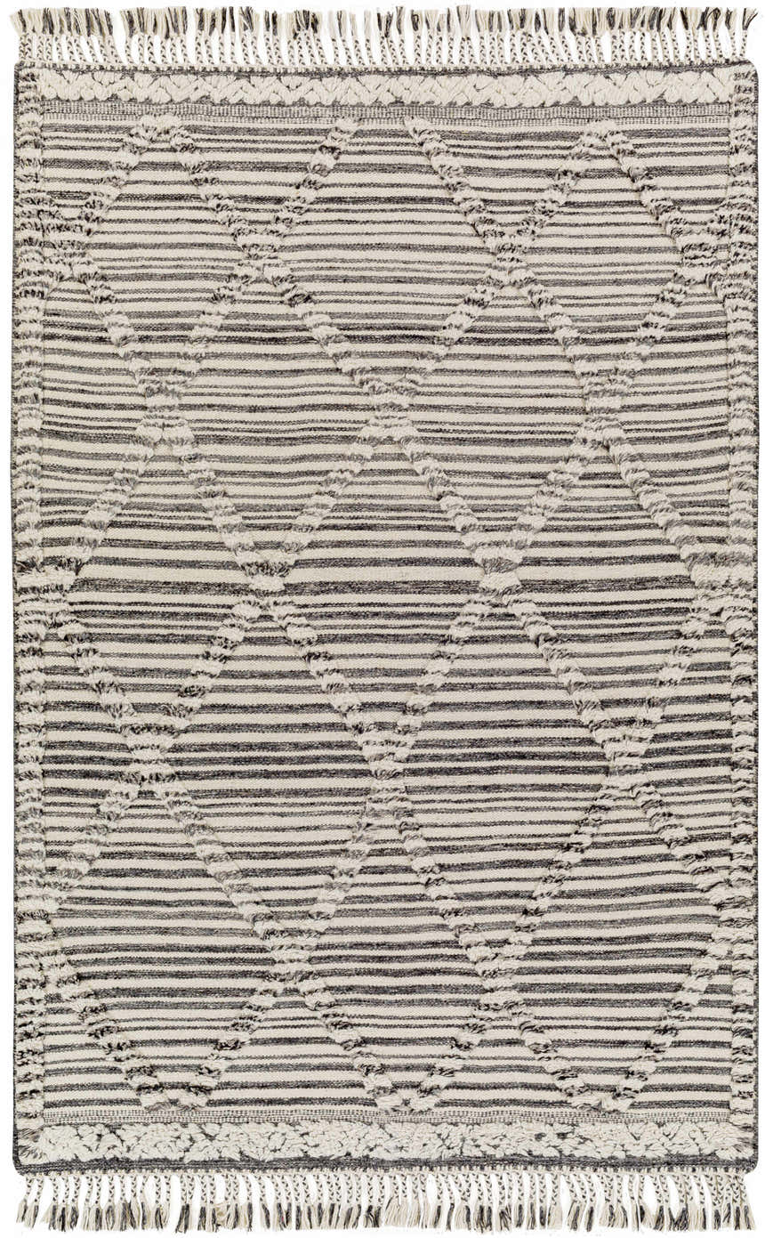 Close-up of the hand-knotted Nairobi Area Rug. Black, gray, and ivory wool rug with striped and diamond patterns and fringe. Design-Rectangle-576