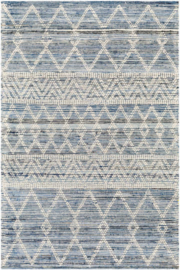 Close-up of the hand woven Nala Area Carpet. Bohemian style rug in charcoal, light blue, and off white. Design-Rectangle-576