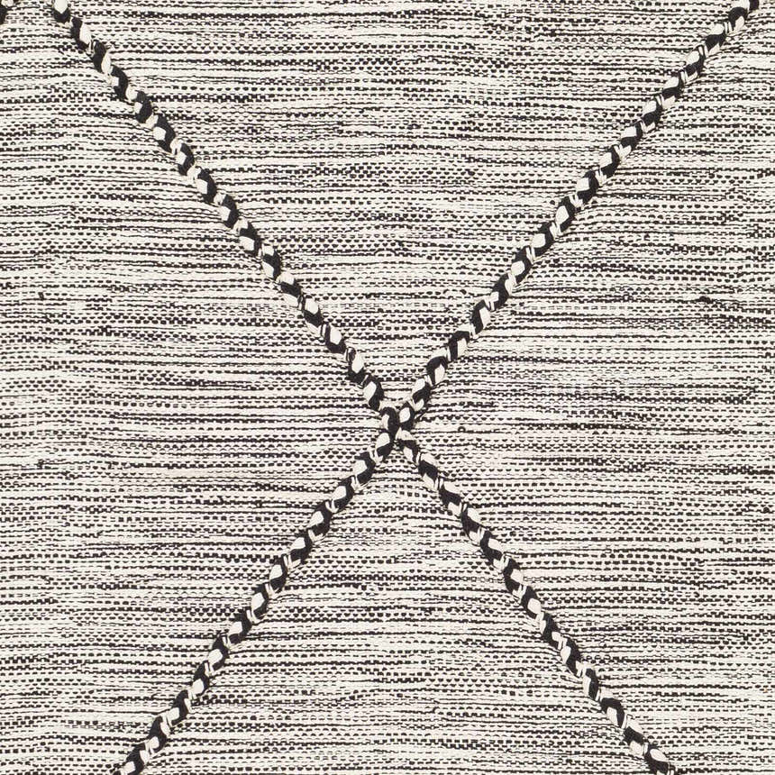Close-up of the Neal Black/Cream Trellis Cotton Rug showing its woven texture and black trellis pattern. Swatch