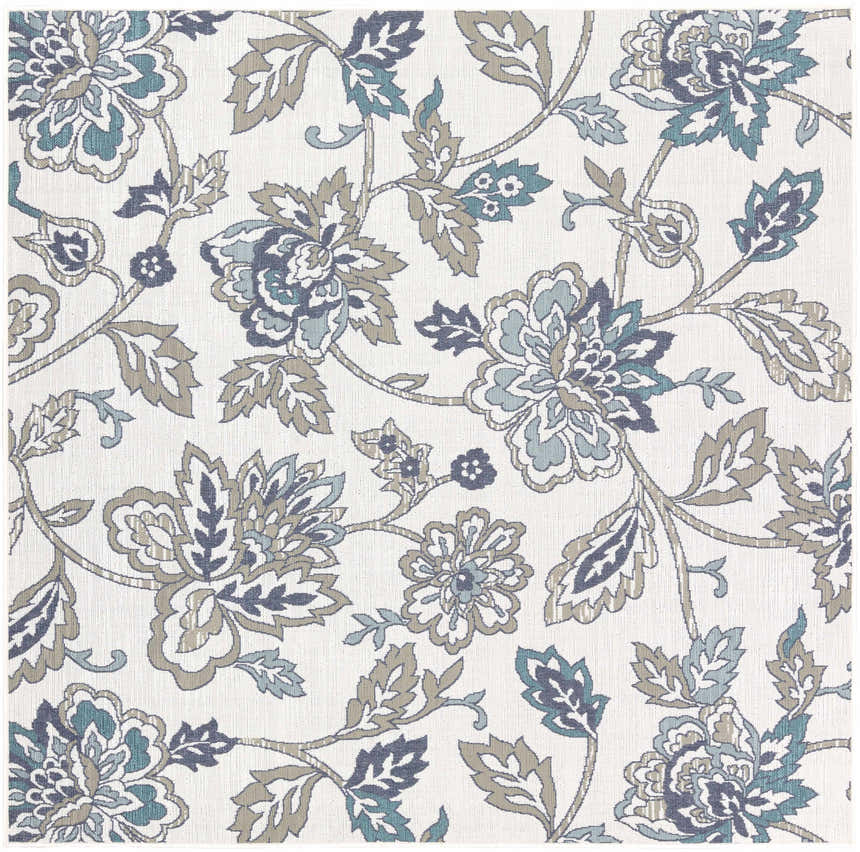Close-up of the Neon Area Rug - Clearance. Floral pattern in navy, pale blue, taupe and white on olefin material. Design-Square-73