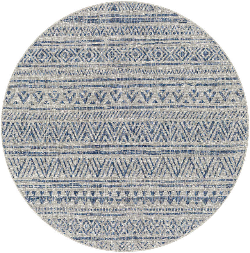 Close-up of round Novato All Over Pattern Performance Rug. Blue geometric design on a light neutral background. Design-Round-67