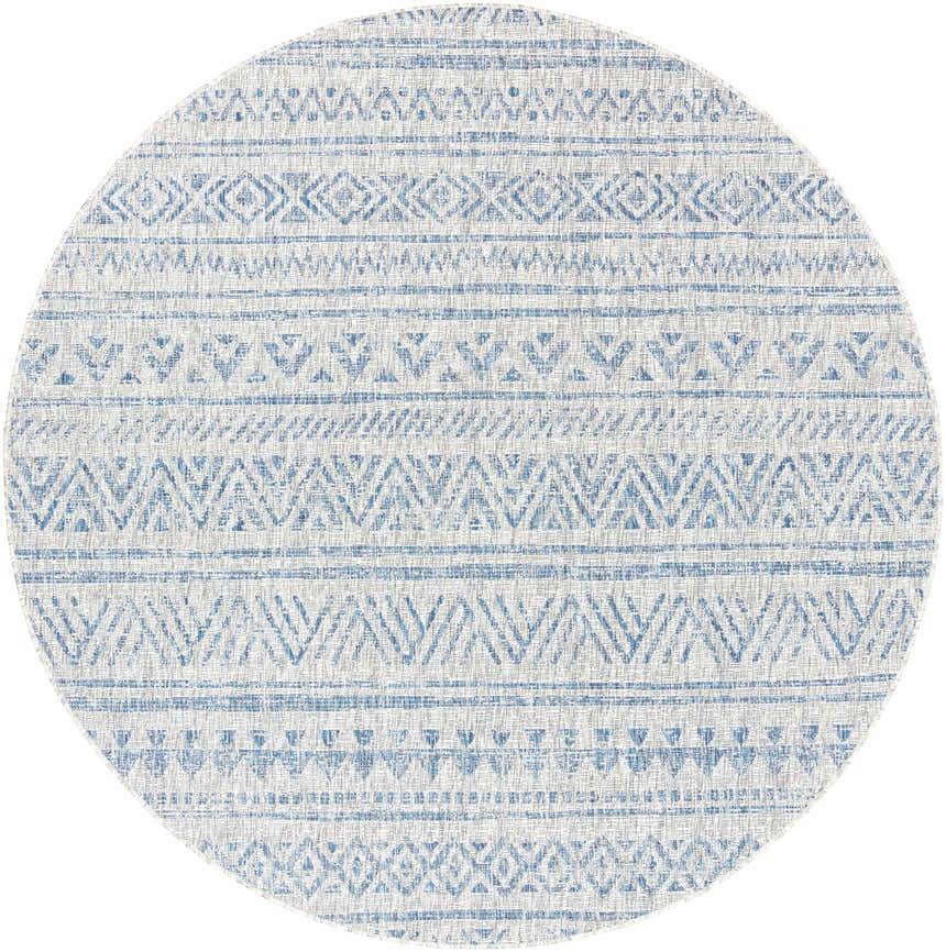 Close-up of the round Novato All Over Pattern Performance Rug. Features blue geometric designs on a light background. Design-Round-710