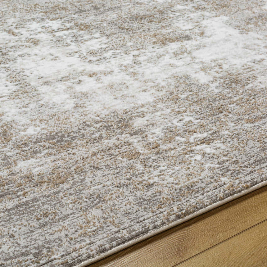 Close-up of the Oshawa Area Rug. Contemporary style with driftwood, gray, ivory, and tan colors. Machine woven texture. Texture