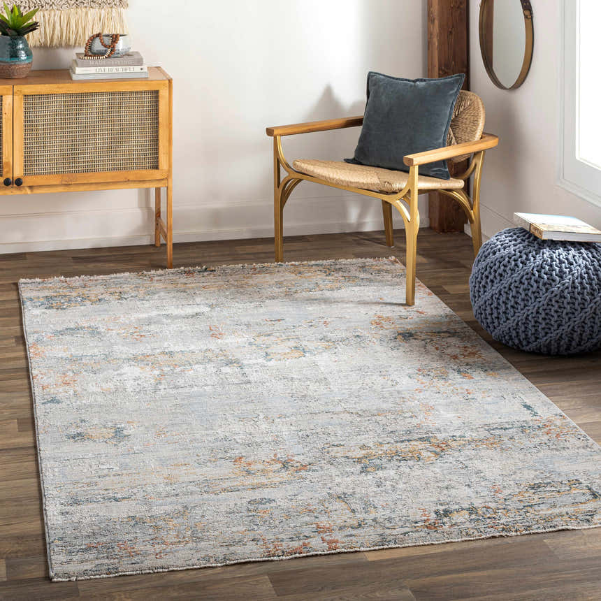 Living room scene with a gray Ottawa Luxe Rug, wooden cabinet, chair, and blue pouf. Roomscene-Rectangle