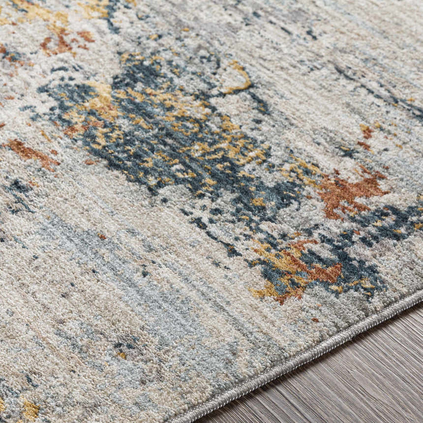 Close-up of the Ottawa Luxe Rug showing its cream, blue, tan, and gray contemporary Persian design. Texture
