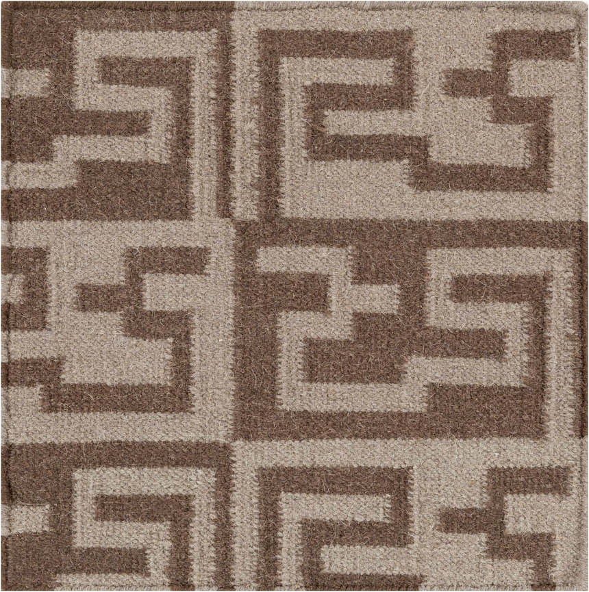 Close-up of the Paxville Area Rug. Beige and dark red wool rug with a hand woven geometric pattern. Swatch