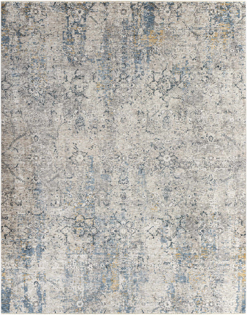 Close-up of the Pence Luxe Fringe Rug. Contemporary style rug in beige, blue, charcoal, and tan with a distressed floral pattern. Design-Rectangle-710103