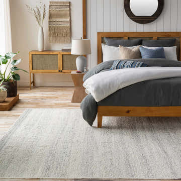 Neutral bedroom with wood furniture and Penticton Cream Flat Woven Wool Rug. Serene, cozy space. Roomscene-Rectangle
