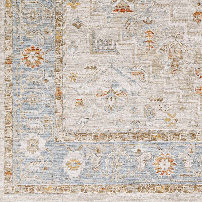 Close-up of the Phyllis Thick Luxe Statement Rug. Features light beige, blue, and orange traditional-style patterns. Swatch