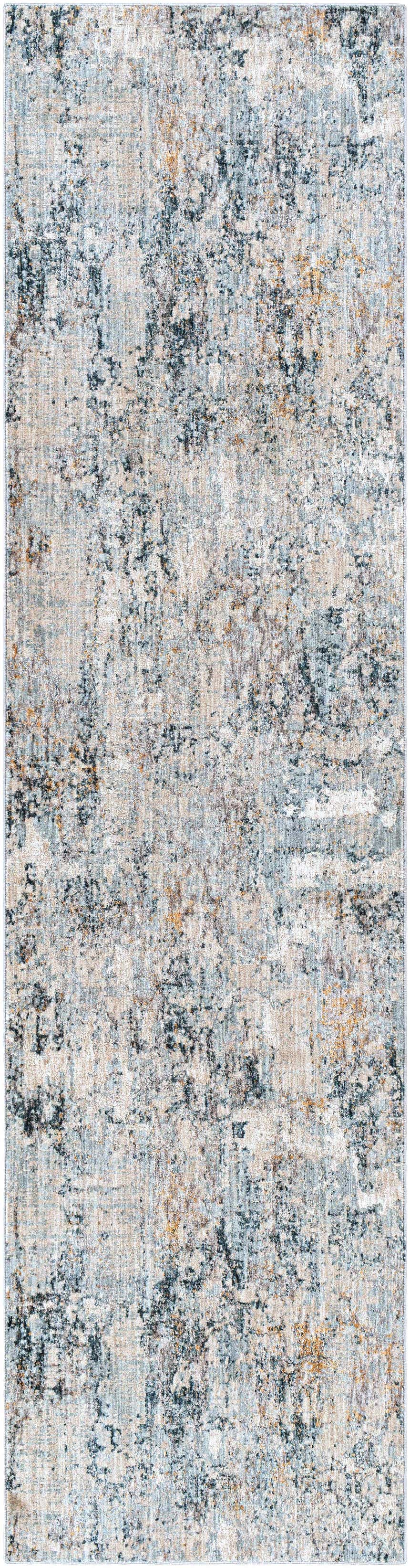 Close-up of the Pinjarra Luxe Rug; a contemporary rug in charcoal, cream, blue, and tan with a distressed abstract design. Design-Runner-2710