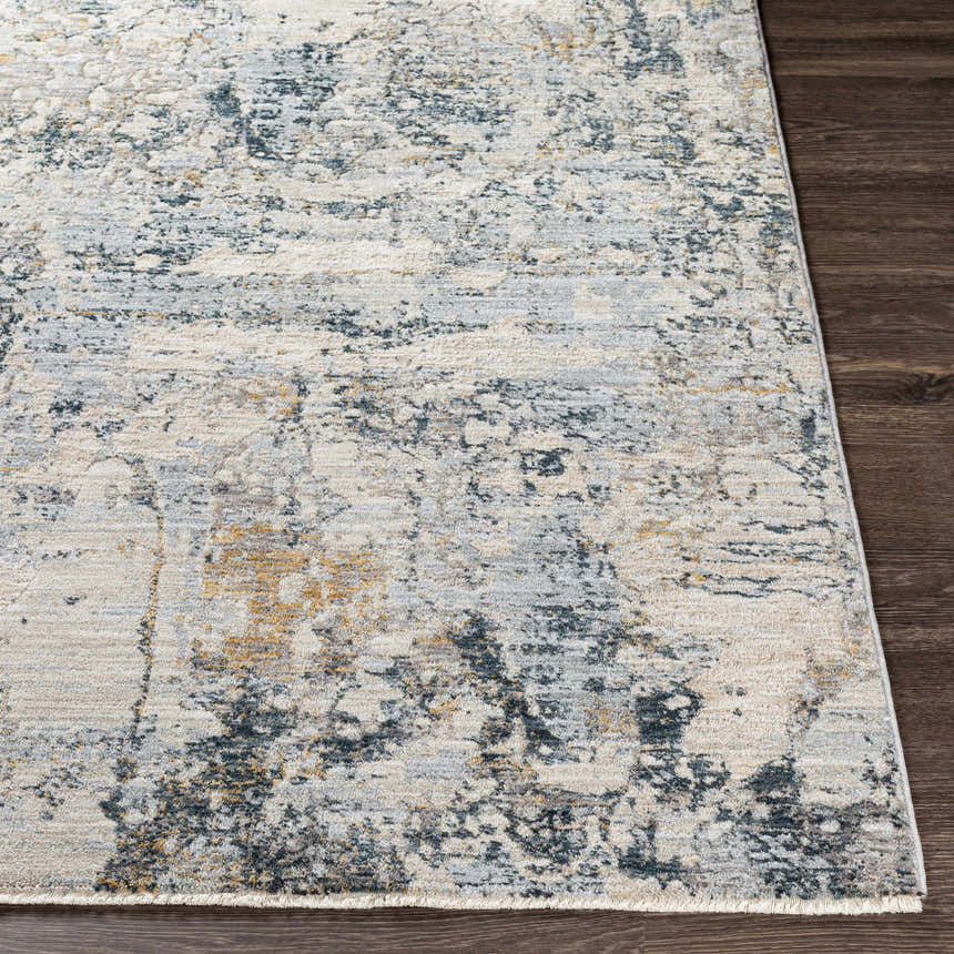 Close-up of the Pinjarra Luxe Rug. Contemporary style with charcoal, cream, and gray abstract pattern. 100% Polyester texture. Front
