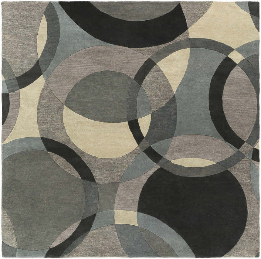 Close-up of the Rilton Gray Wool Carpet, featuring a contemporary circle pattern in black, charcoal, gray, taupe, and teal. Design-Square-8
