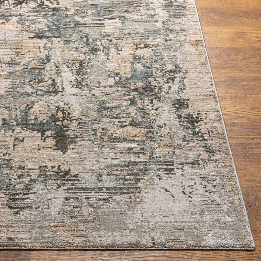 Close-up of the Palanit Thick Luxe Boutique Rug showing its charcoal, beige, and teal abstract design and plush texture. Front