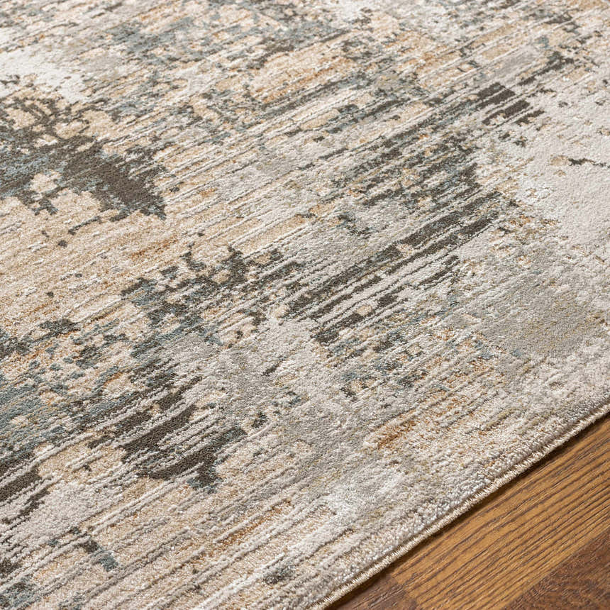 Close-up of the Palanit Thick Luxe Boutique Rug showing a contemporary abstract pattern in beige, gray, teal, and charcoal. Texture