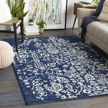 Living room scene with Poole Navy Wool Area Carpet, beige sofa, and modern decor. Roomscene-Rectangle