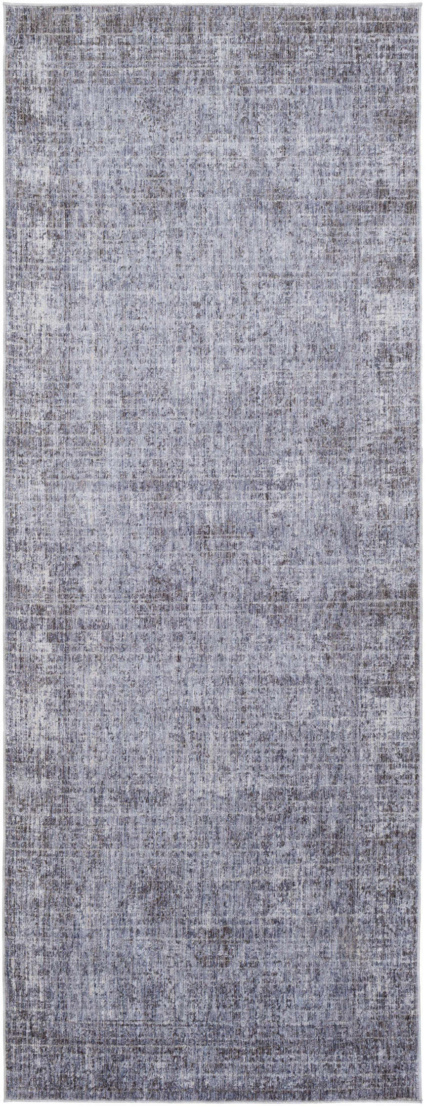 Close-up of the Plympton Carved Statement Rug. Machine woven polyester rug in blue, charcoal, and gray with a subtle carved texture. Design-Runner
