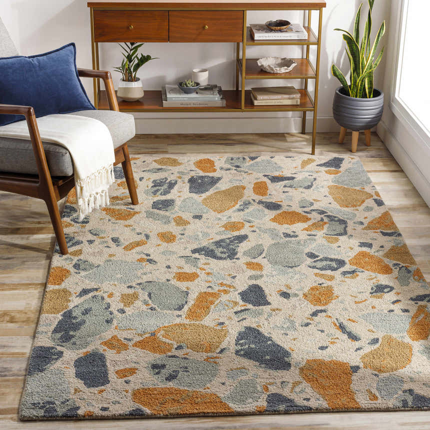 Living room scene with mid-century modern furniture and a Panabingan Area Rug in brick red, beige, blue, and brown. Roomscene-Rectangle