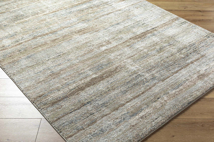 Close-up of the Agueda Thick Luxe Rug. Colors include beige, light gray, olive, tan, and teal. Contemporary style. Corner