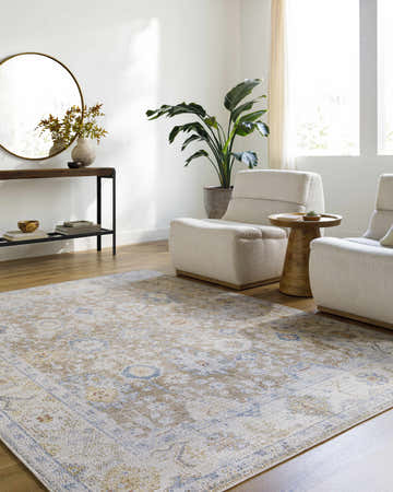 Living room scene with beige armchairs and the beige, denim, and mustard Widad Area Rug. Roomscene-Rectangle