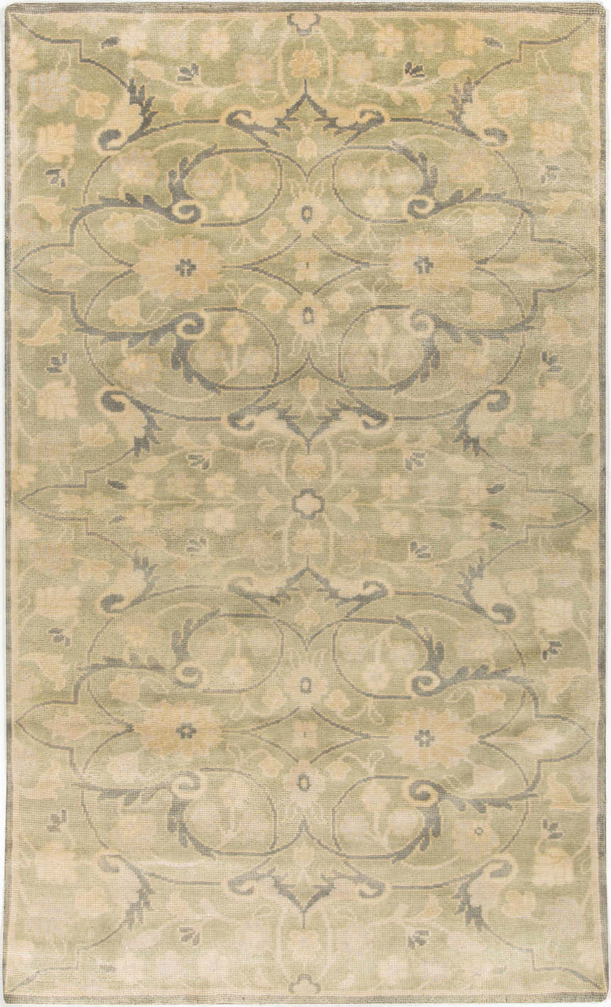 Detailed view of the Raceland Area Carpet, featuring a traditional floral pattern in beige, olive, and mustard tones. Hand-knotted wool texture. Design-Rectangle-5686