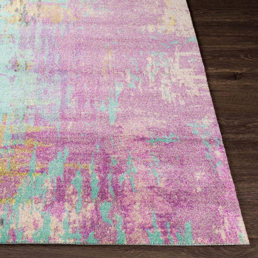 Close-up of the Redland colorful abstract rug showing its magenta, aqua, and gray hues and soft texture. Front