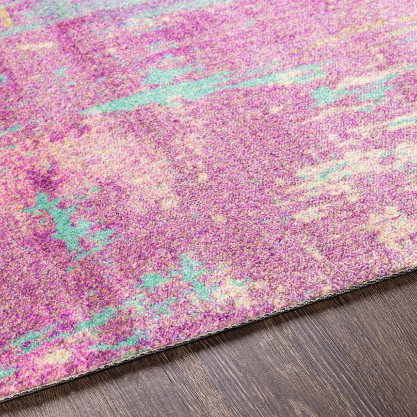 Close-up of the Redland Colorful Abstract Rug, showing magenta and teal hues with a textured, machine-woven design. Texture