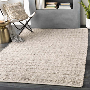 Scandinavian-style room with a metallic silver Argonne Area Rug, white chair, and gold side table. Roomscene-Rectangle