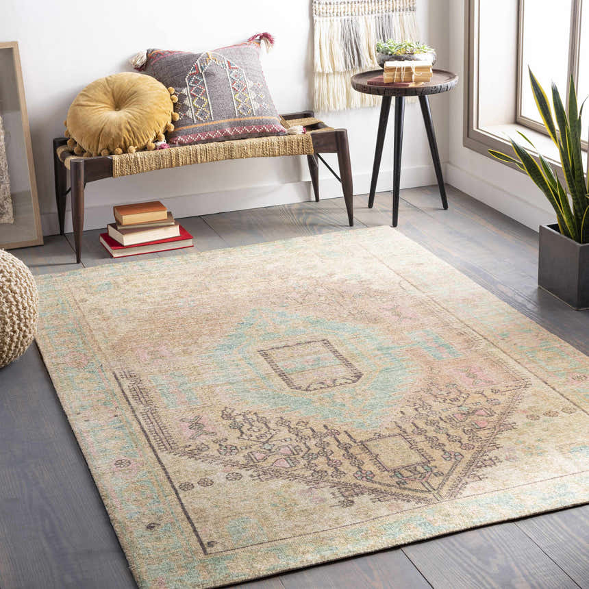 Bohemian room scene with Rickinghall Peach&Sage Medallion Beige Rug, bench with pillows, and potted plant. Roomscene-Rectangle