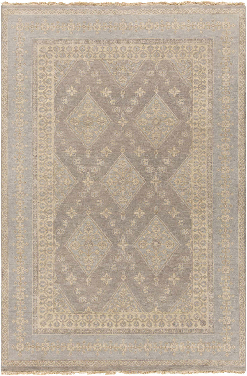 Close-up of the Roma Area Rug, a hand-knotted wool rug in medium gray and taupe with a traditional diamond pattern. Design-Rectangle-69