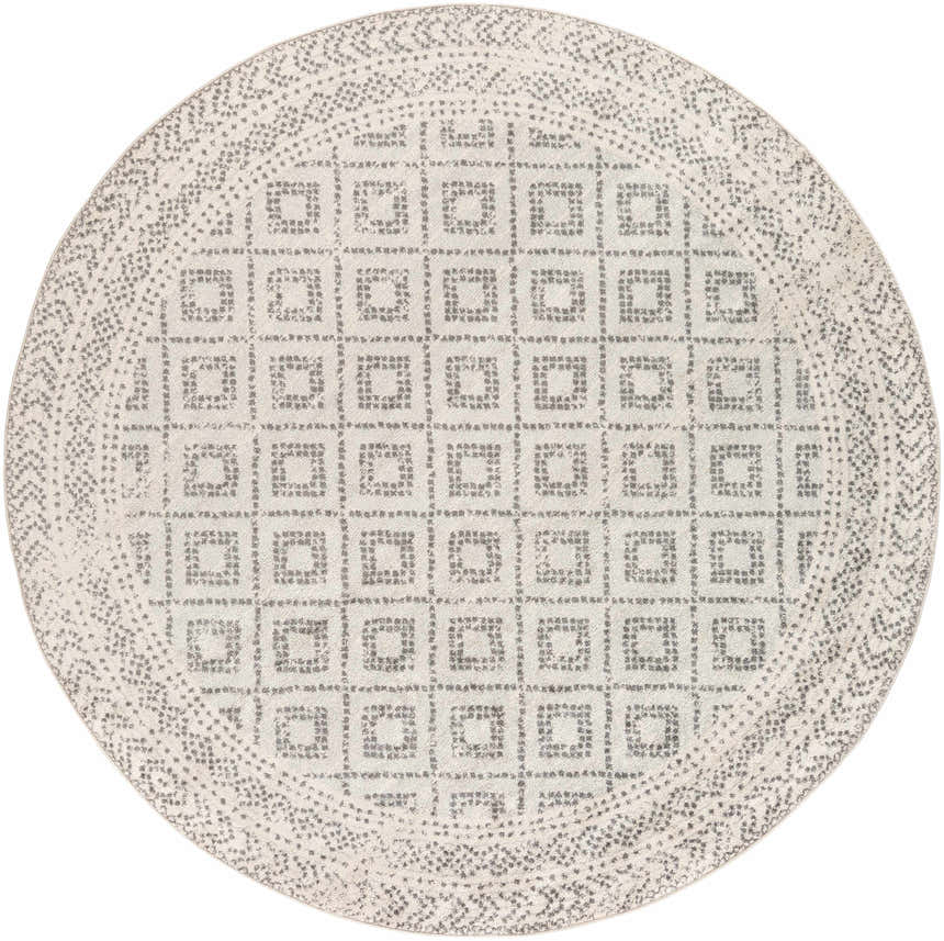 Close-up of round Romeoville Area Rug. Bohemian style rug in charcoal, gray, and white with a geometric pattern. Design-Round-710