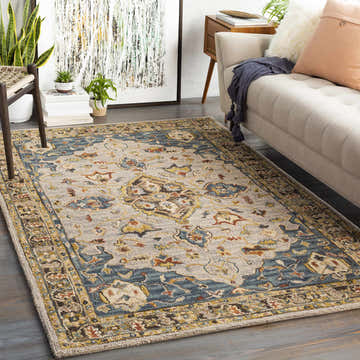 Living room scene with a beige sofa and the Rozel Area Rug in brown, teal, and beige oriental pattern. Roomscene-Rectangle