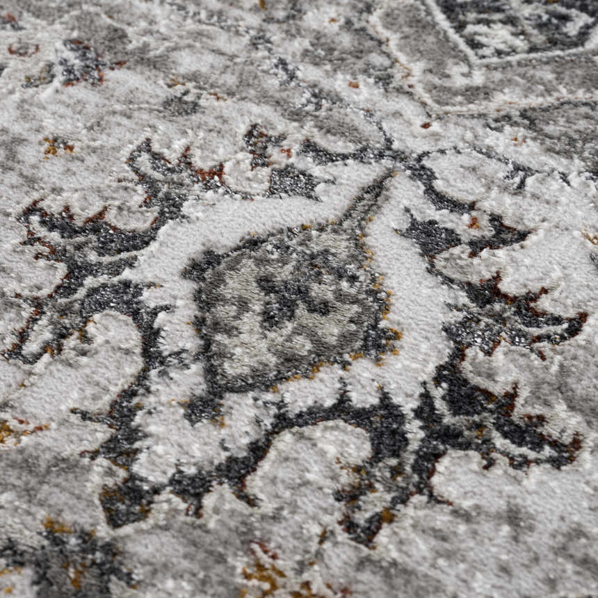 Close-up of the Liverpool Dark Gray Area Rug showing its traditional charcoal, gray, and rust floral pattern. Texture